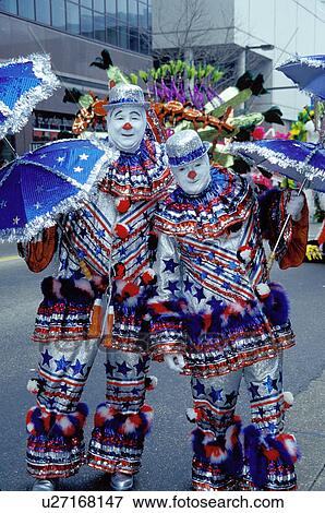 clown, humor, costume, parade, Philadelphia, PA, Pennsylvania, Two men dressed as clowns in funny red, white and blue outfits with umbrellas pose for a picture in the Mummers Day Parade on New Years Day in Philadelphia. View Large Photo Image Stock Photo -  clown, humor, costume, parade, Philadelphia, PA, Pennsylvania, Two men dressed as clowns in funny red, white and blue outfits with umbrellas pose for a picture in the Mummers Day Parade on New Years Day in Philadelphia.. Fotosearch