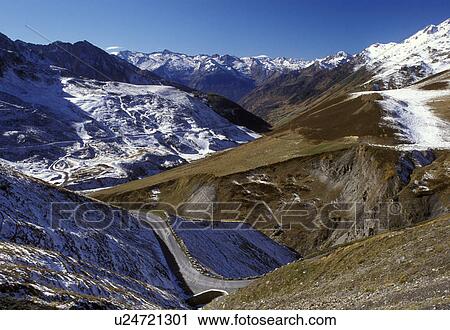 Col du Tourmalet, France, Midi-Pyrenees, The Pyrenees, Hautes-Pyrenees, Europe, A mountain road winds down through the snow capped Pyrenees Mountains and the valley below of Col du Tourmalet. View Large Photo Image Stock Image - Col du Tourmalet, France, Midi-Pyrenees, The Pyrenees, Hautes-Pyrenees, Europe, A mountain road winds down through the snow capped Pyrenees Mountains and the valley below of Col du Tourmalet.. Fotosearch