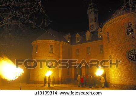 Colonial Williamsburg, Virginia, VA, Williamsburg, Illumination of Palace Green at Christmas in the evening in Colonial Williamsburg. Flickering cresset lights guide visitors through tours of historic buildings. View Large Photo Image Picture - Colonial Williamsburg, Virginia, VA, Williamsburg, Illumination of Palace Green at Christmas in the evening in Colonial Williamsburg. Flickering cresset lights guide visitors through tours of historic buildings.. Fotosearch