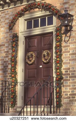 Colonial Williamsburg, Virginia, VA, Williamsburg, Christmas decorations made of greens and apples on a colonial house in Colonial Williamsburg. View Large Photo Image Stock Image - Colonial Williamsburg, Virginia, VA, Williamsburg, Christmas decorations made of greens and apples on a colonial house in Colonial Williamsburg.. Fotosearch
