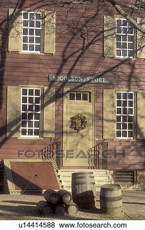 Stock Photo -  Colonial Williamsburg, Virginia, VA, Williamsburg, A wreath made of greens and fruit decorate the door of Nicholson Store for Christmas in Colonial Williamsburg.. Fotosearch
