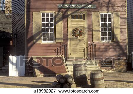 Stock Photo -  Colonial Williamsburg, Virginia, VA, Williamsburg, A wreath made of greens and fruit decorate the door of Nicholson Store for Christmas in Colonial Williamsburg.. Fotosearch