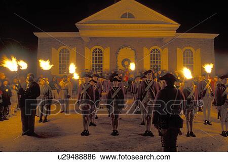 Colonial Williamsburg, Virginia, VA, Williamsburg, Fifes and Drums at Illumination of Market Square at Christmas in front of the Courthouse in the evening in Colonial Williamsburg. Flickering cresset lights guide visitors through tours of historic buildi View Large Photo Image Stock Photograph - Colonial Williamsburg, Virginia, VA, Williamsburg, Fifes and Drums at Illumination of Market Square at Christmas in front of the Courthouse in the evening in Colonial Williamsburg. Flickering cresset lights guide visitors through tours of historic buildi. Fotosearch