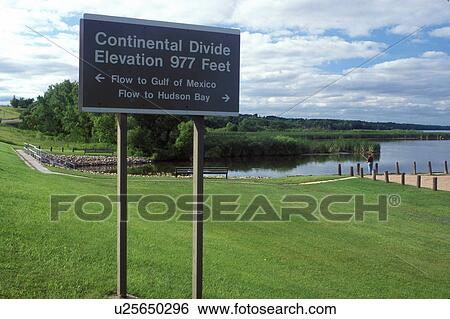 Continental Divide, MN/SD, Minnesota, South Dakota, Minnesota River, Traverse Lake, Continental Divide sign in Browns Valley indicating the flow of the rivers to the Gulf of Mexico and to the Hudson Bay. View Large Photo Image Stock Photograph - Continental Divide, MN/SD, Minnesota, South Dakota, Minnesota River, Traverse Lake, Continental Divide sign in Browns Valley indicating the flow of the rivers to the Gulf of Mexico and to the Hudson Bay.. Fotosearch