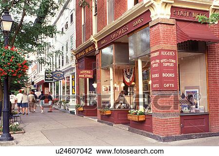 Stock Image -  Cooperstown, NY, New York, Shops along the main street in downtown Cooperstown.. Fotosearch