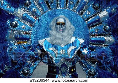 costume, masquerade, Philadelphia, parade, PA, Pennsylvania, A man in the Fancy Division is dressed in a blue costume of feathers wearing a silver mask in the Mummers Day Parade on New Years Day in Philadelphia. View Large Photo Image Picture - costume, masquerade, Philadelphia, parade, PA, Pennsylvania, A man in the Fancy Division is dressed in a blue costume of feathers wearing a silver mask in the Mummers Day Parade on New Years Day in Philadelphia.. Fotosearch