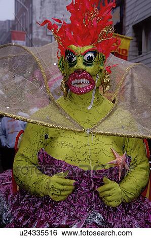 Stock Photograph -  costume, Philadelphia, PA, Pennsylvania, Man dressed in a costume of green with red hair in the Fancy Division in the Mummers Day Parade on New Years Day in Philadelphia.. Fotosearch