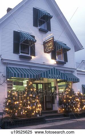 Stock Photography -  country market, country store, christmas decorations, winter, Christmas lights decorate Peltier Country Market in Dorset for Christmas in the evening in winter in Bennington County in the state of Vermont. . Fotosearch