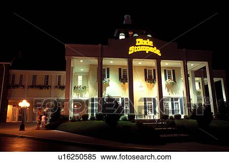 Stock Photography -  country music, music theatre, Branson, MO, Missouri, Dixie Stampede Music Theater at night in Branson.. Fotosearch