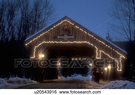 covered bridge, bridge, decorations, holiday, winter, snow, Battleground Covered Bridge is decorated with white lights for the Christmas holiday season at night in Fayston in the Mad River Valley in Washington County in the state of Vermont. View Large Photo Image Stock Photograph - covered bridge, bridge, decorations, holiday, winter, snow, Battleground Covered Bridge is decorated with white lights for the Christmas holiday season at night in Fayston in the Mad River Valley in Washington County in the state of Vermont.. Fotosearch