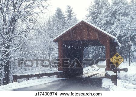 Picture -  covered bridge, country road, winter, Northfield Falls, Vermont, VT, Upper Covered Bridge on a snowy day in Northfield Falls in winter.. Fotosearch
