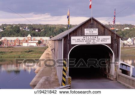 Stock Image -  covered bridge, New Brunswick, Hartland, NB, Canada, World's Longest Covered Bridge (1282 ft. ) crosses over St. John's River in the town of Hartland. . Fotosearch