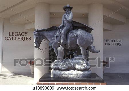 Stock Photo -  cowboy sculpture, Scottsdale, Arizona, AZ, Cowboy on horse sculpture at Legacy and Heritage Galleries in downtown Scottsdale.. Fotosearch