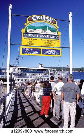 Stock Image -  cruise, New Hampshire, Weirs Beach, NH, Passengers standing in line waiting to board the M. S. Mt. Washington Cruise Boat on Lake Winnipesaukee.. Fotosearch