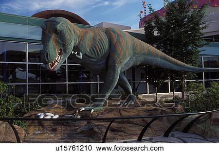 Stock Image -  dinosaur, children's museum, Indianapolis, IN, Indiana, Model of a Tyrannosaurus Rex Dinosaur outside The Children's Museum of Indianapolis and Cinedome Theater. . Fotosearch