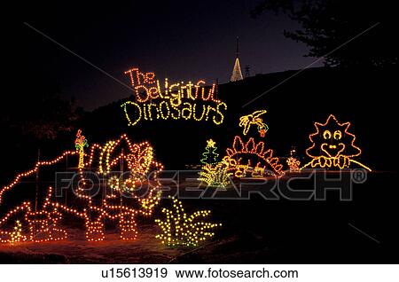 Stock Photo -  dinosaur, Georgia, GA, Atlanta, Colorful Christmas lights decorate large delightful dinosaurs at Georgia's Stone Mountain Park.. Fotosearch