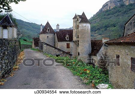 Dordogne, Perigord, France, Midi-Pyrenees, Lot, Autoire, Europe, A narrow street winds through the medieval village of Autoire. View Large Photo Image Picture - Dordogne, Perigord, France, Midi-Pyrenees, Lot, Autoire, Europe, A narrow street winds through the medieval village of Autoire.. Fotosearch
