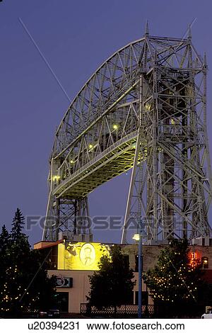 Stock Image -  Duluth, MN, Minnesota, Aerial Lift Bridge, 386 feet long, at Canal Park in Duluth in the evening.. Fotosearch