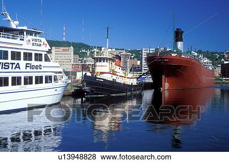 Stock Photo -  Duluth, MN, Minnesota, Vista Fleet/Duluth-Superior Excursion boat and the William A. Irwin Ore Boat moored at the dock in Duluth Harbor on Lake Superior in Duluth.. Fotosearch