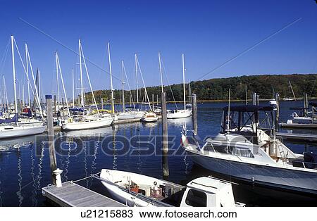 Stock Image -  East Greenwich, Rhode Island, RI, Boats dock at Milt's Marina on Greenwich Bay in East Greenwich in the fall.. Fotosearch