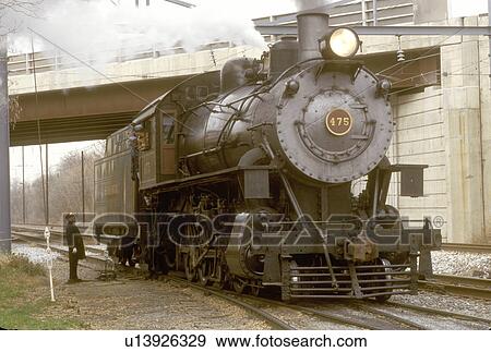 Stock Photo -  engine, locomotive, Strasburg, Pennsylvania, Lancaster County, PA, The conductor talks with the engineer driving the locomotive to the excursion train, Strasburg Railroad Company in Strasburg.. Fotosearch
