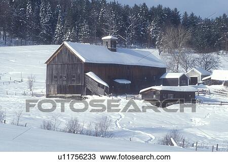 Stock Image -  farm, barn, winter, Calais, Vermont, VT, Large wooden brown barn on a farm in winter in Calais.. Fotosearch