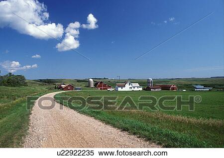 Stock Photography -  farm, SD, South Dakota, Sisseton Indian Reservation, Day County, Coteau des Prairies, Country road leads up to red barn on a farm in Coteau des Prairies.. Fotosearch