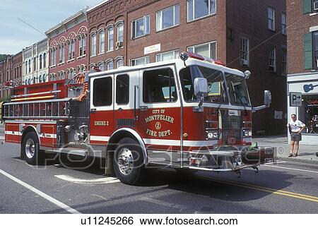 fire truck, Vermont, VT, A red & wihite fire engine drives down Main Street in Montpelier. View Large Photo Image Stock Photograph - fire truck, Vermont, VT, A red & wihite fire engine drives down Main Street in Montpelier.. Fotosearch