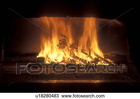 fireplace, fire, flame, brick oven, wood stove, Wood burning in a fireplace. View Large Photo Image Stock Image - fireplace, fire, flame, brick oven, wood stove, Wood burning in a fireplace. . Fotosearch