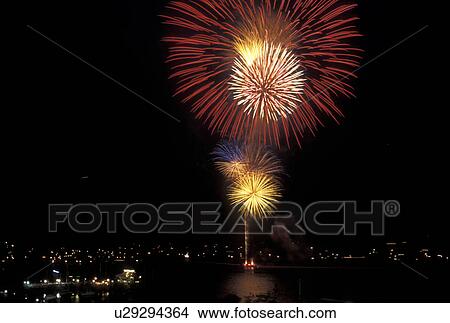 Picture -  firework, Vermont, VT, Burlington, Fourth of July fireworks display over Lake Champlain on the waterfront in Burlington at night.. Fotosearch