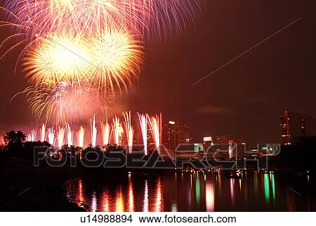 fireworks, skyline, Columbus, OH, Ohio, Firework display over the downtown skyline of Columbus on the Fourth of July along the Scioto River. View Large Photo Image Picture -  fireworks, skyline, Columbus, OH, Ohio, Firework display over the downtown skyline of Columbus on the Fourth of July along the Scioto River.. Fotosearch