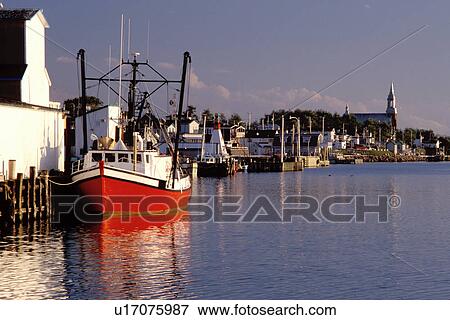 Stock Photo -  fishing boats, Cape Breton, Nova Scotia, NS, Canada, Fishing boats docked in the harbor of Cheticamp on the Gulf of St. Lawrence in Cape Breton. . Fotosearch