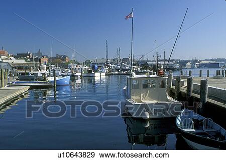 Stock Photo -  fishing boats, Gloucester, MA, Massachusetts, Fishing boats docked at the marina in the Inner Harbor in Gloucester in the fall.. Fotosearch