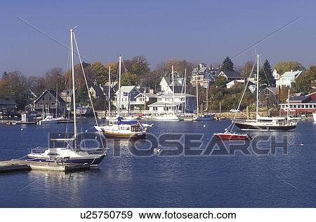 Stock Photo -  fishing boats, harbor, Gloucester, MA, Massachusetts, Fishing boats moored at the marina in the Inner Harbor of Rocky Neck in Gloucester in the fall.. Fotosearch