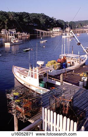 Stock Image -  fishing boats, New Harbor, Maine, ME, Pemaquid, Fishing boats, fishermen, dock, lobster traps in the harbor. . Fotosearch