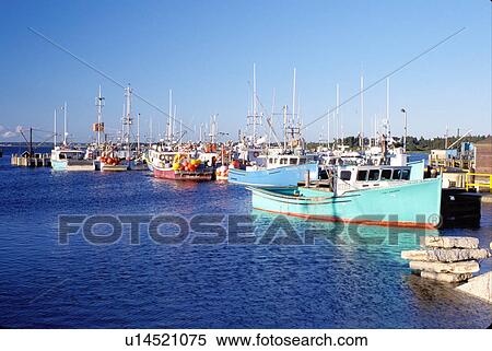 Stock Photography -  fishing boats, Nova Scotia, Cape Sable Island, NS, Canada, Fishing boats docked in the harbor on Cape Sable Island on the Atlantic Ocean. . Fotosearch