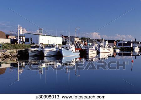 Stock Image -  fishing harbor, Cape Breton, Nova Scotia, NS, Canada, Fishing boats docked in the harbor of Cheticamp on the Gulf of St. Lawrence in Cape Breton. . Fotosearch