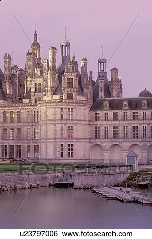 Stock Photograph -  France, Chambord, Loire Castle Region, chateau, castle, Loir-et-Cher, Centre, Europe, The Renaissance Chateau of Chambord in the evening. Largest of all the castles in the Loire Valley.. Fotosearch