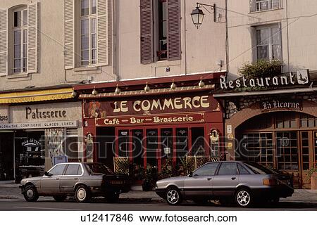 Stock Photograph -  France, Chateaudun, Eure-et-Loir, Centre, Europe, CafT along the street in the town of Chateaudun.. Fotosearch