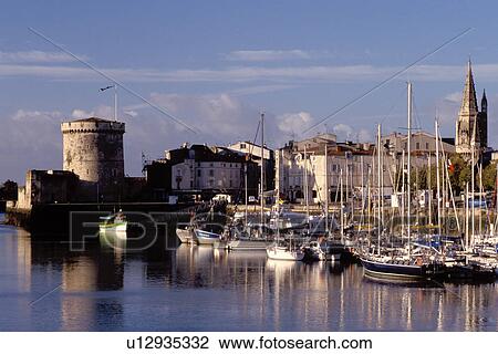 France, La Rochelle, Poitou-Charentes, Europe, 14th century medieval stone tower at the entrance to the harbor of the ancient fortified old port city of La Rochelle on the Atlantic Ocean. View Large Photo Image Stock Image - France, La Rochelle, Poitou-Charentes, Europe, 14th century medieval stone tower at the entrance to the harbor of the ancient fortified old port city of La Rochelle on the Atlantic Ocean.. Fotosearch