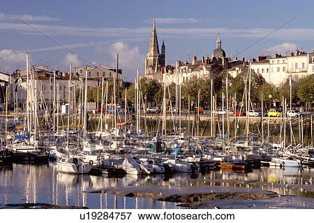 Stock Photo -  France, La Rochelle, Poitou-Charentes, Charente-Maritime, Europe, The ancient fortified old port city of La Rochelle on the Atlantic Ocean.. Fotosearch