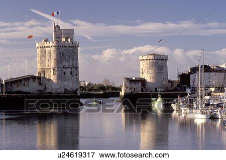 France, La Rochelle, Poitou-Charentes, Europe, 14th century medieval stone towers at the entrance to the harbor of the ancient fortified old port city of La Rochelle on the Atlantic Ocean. View Large Photo Image Stock Photo - France, La Rochelle, Poitou-Charentes, Europe, 14th century medieval stone towers at the entrance to the harbor of the ancient fortified old port city of La Rochelle on the Atlantic Ocean.. Fotosearch
