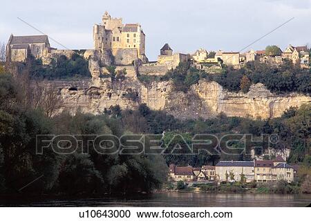 Stock Image -  France, Perigord, Dordogne, Beynac-et-Cazenac, Aquitaine, Europe, The medieval village of Beynac-et-Cazenac along the bank of the Dordogne River.. Fotosearch