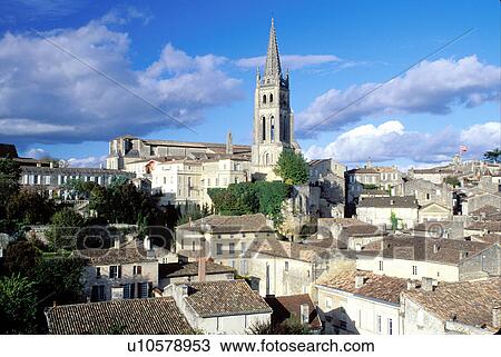 Stock Image -  France, Saint Emilion, Bordeaux Wine Region, Gironde, Aquitaine, Europe, Eglise Monolithe rises above the medieval village of St. Emilion.. Fotosearch