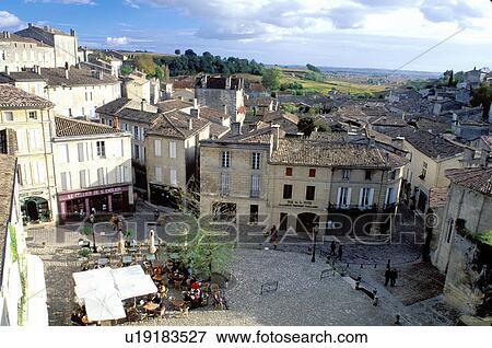 Stock Photo -  France, Saint Emilion, Bordeaux Wine Region, Gironde, Aquitaine, Europe, Aerial view of an outdoor cafT in the medieval village of St. Emilion.. Fotosearch