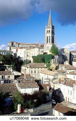 Stock Photo -  France, Saint Emilion, Gironde, Bordeaux Wine Region, Europe, Aquitaine, Eglise Monolithe rises above the medieval village of St. Emilion.. Fotosearch