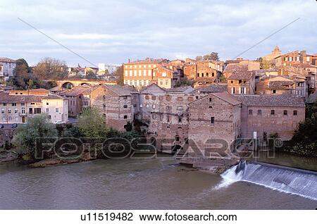 Stock Image -  France, Tarn, Midi-Pyrenees, Gaillac, Europe, Sunset over the village of Gaillac and Tarn River.. Fotosearch