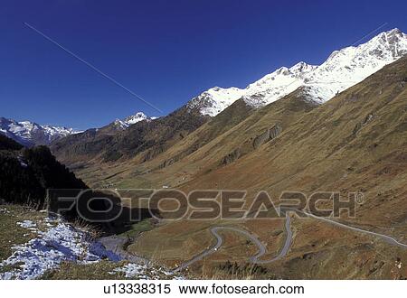Stock Photography -  France, The Pyrenees, Midi-Pyrenees, Col du Tourmalet, Hautes-Pyrenees, Europe, Scenic view of the snow capped Pyrenees Mountains and the valley below of Col du Tourmalet.. Fotosearch