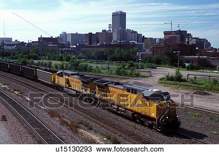 freight train, Omaha, NE, Nebraska, Union Pacific Railroad, A freight train carrying cars full of coal is pulled by 2 large engines with downtown Omaha in the background. View Large Photo Image Stock Image - freight train, Omaha, NE, Nebraska, Union Pacific Railroad, A freight train carrying cars full of coal is pulled by 2 large engines with downtown Omaha in the background.. Fotosearch