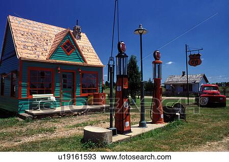 Stock Image -  gas station, ghost town, Carthage, MO, Missouri, Old Phillip 66 gas station with a red antique truck parked outside at Red Oak II a ghost town. . Fotosearch